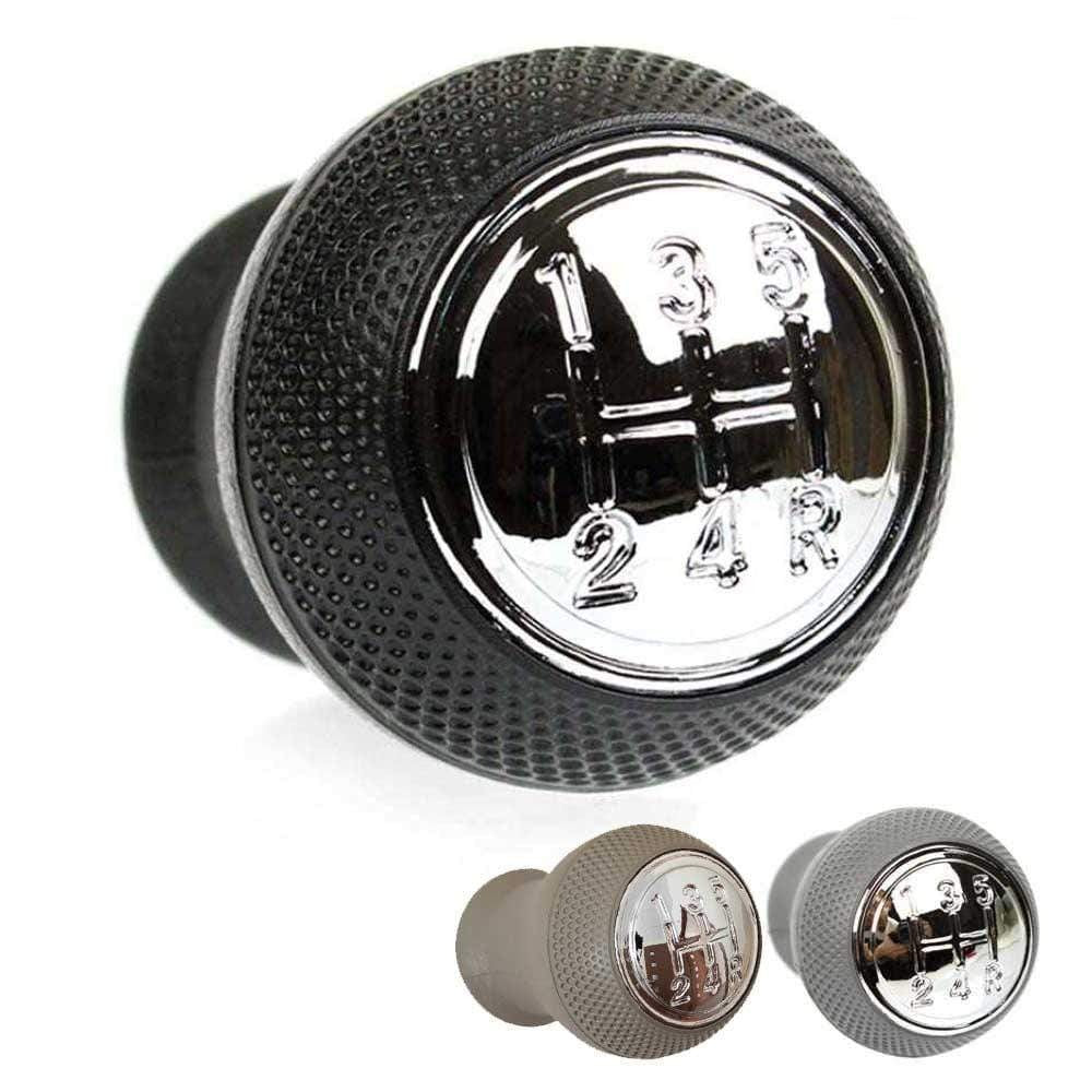 Fekete, szürke és bézs színű Mazda váltógomb. Krómozott, 5 fokozatos számlappal.