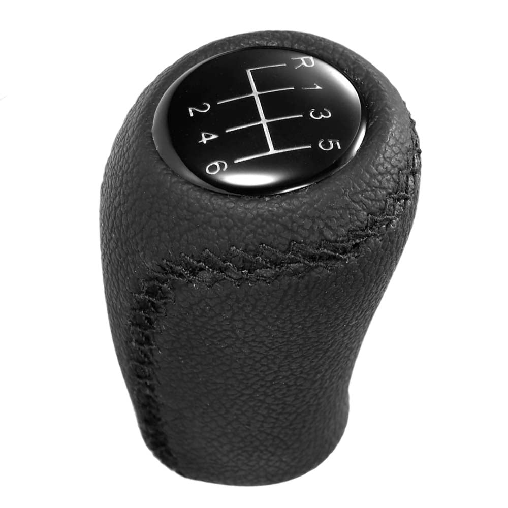 Fekete színű, 6 sebességes bőr Mazda váltógomb. 6 fokozatos üveg számlappal