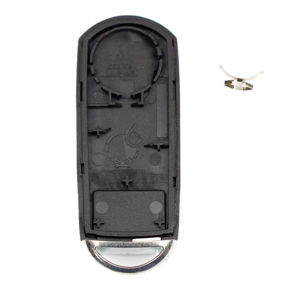 Fekete színű, 4 gombos Mazda kulcsház, kulcs belseje.